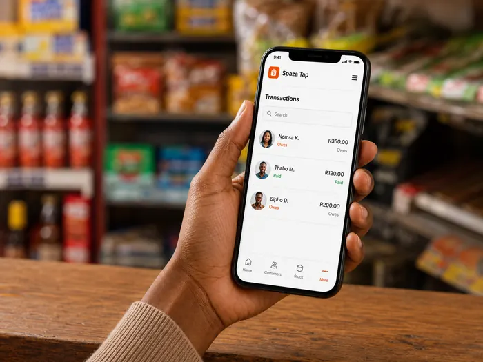 Spaza Tap transactions screen on a phone showing customer balances.